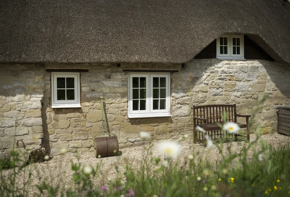 Stone cottage with heritage-style casement windows – Roundhay Windows And Doors